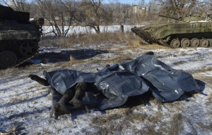 Bodies of Ukrainian soldiers killed in Debaltseve are pictured on stretchers at a military camp in Artemivsk