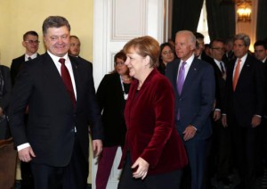 Ukraine's President Poroshenko, German Chancellor Merkel and U.S. Vice President Biden arrive for a meeting as U.S. Secretary of State Kerry looks on during the 51st Munich Security Conference at the 'Bayerischer Hof' hotel in Munich