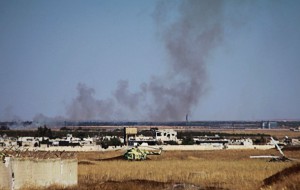 Smoke rises during clashes from inside the Menagh airport which, according to the FSA, is partially controlled by Syrian regime forces in Aleppo's countryside, July 26, 2013. REUTERS/Hamid Khatib (SYRIA - Tags: CONFLICT)